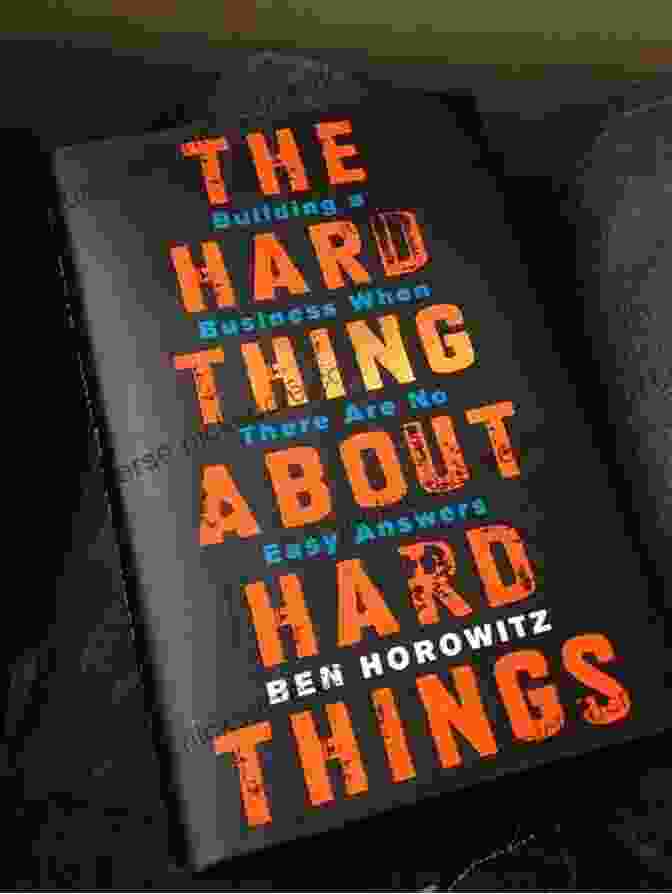 A Book Titled 'The Hard Thing About Hard Things' By Ben Horowitz, Sitting On A Desk With A Laptop And Other Office Supplies The Hard Thing About Hard Things: Building A Business When There Are No Easy Answers