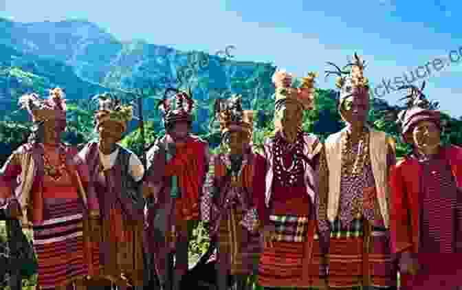 A Group Of Indigenous Peoples Standing In A Grassy Field, Surrounded By Mountains. We Come With This Place
