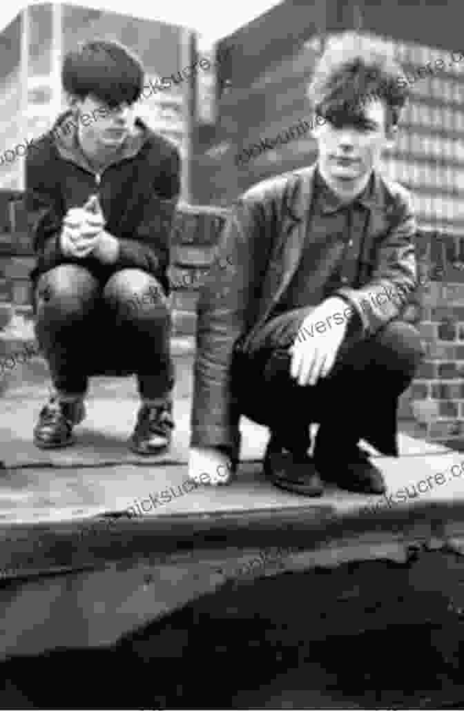 A Young Bobby Gillespie, Standing On A Glasgow Street In The 1960s, His Eyes Gazing Into The Camera With A Mischievous Glint Tenement Kid: From The Streets Of Glasgow In The 1960s To Drummer In Jesus And Mary Chain And Frontman In Primal Scream