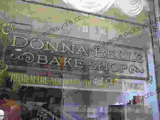 Exterior Of Donna Bell Bake Shop, A Charming And Inviting Brick Building With Large Windows Displaying Tantalizing Pastries Donna Bell S Bake Shop: Recipes And Stories Of Family Friends And Food